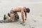 Kneeling Shirtless Soldier with Fists on Ground