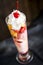 Knickerbocker glory Ice cream sundae with fruit and whipped cream