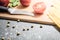 Knife On A Carving Board With Kitchen Ingredients Like Tomatoes, Pepper And Salt - Preparing Dinner Concept