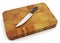 Knife on chopping board