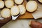 Knife cuts batata on round slices with skin of raw red sweet potatoes on baking paper. cooking homemade simple food, Yam recipes