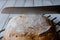 Knife cutting a loaf of homemade no-knead bread