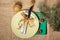 Knife and fork on white plate and green napkin, cones, glittering ball and natural fir tree branches