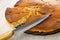 Knife, piece of muffin in gray plate on on wooden table