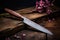 knife resting on a sharpening stone against a wooden background