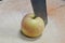 Knife slash on apple on wooden chop block