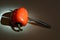 Knife slicing a red bell pepper