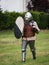 Knight in Battle with Silver Helmet, Armor, Shield and Sword