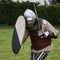 Knight in Battle with Silver Helmet, Armor, Shield and Sword