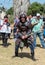 A knight festival participant dressed in a samurai costume prepared for a fight with a foam sword with a visitor in Goren park in