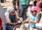 A knight festival participant tells a small visitor how to make a clay pitcher on a potter`s wheel in Goren park in Israel