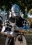 knight full plate medieval armor posing in front of the camera