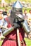 Knight in a helmet and armor at the historical reconstruction of the