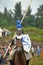 Knight helmet and shield on horseback through the joust