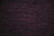 Knitted background. Burgundy wool knit fabric texture.