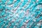 Knitted background with white and aquamarine threads