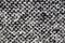Knitted blanket texture. Cozy black and white warm textured background. Surface of woven plaid