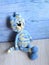 Knitted blue striped handmade crafted cat. Children`s toy. Crochet pattern