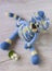 Knitted blue striped handmade crafted cat. Children`s toy. Crochet pattern