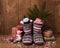 Knitted Christmas boots with a pattern,gifts in bright packaging, confetti. new year`s still life