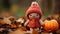 a knitted doll wearing a red hat and holding a pumpkin