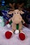 knitted elk. cute moose. toy against the background of a New Year\\\'s garland, knitted hare and elk on a Christmas tree