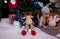 knitted elk. cute moose. toy against the background of a New Year\\\'s garland, knitted hare and elk on a Christmas tree