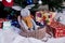 knitted elk. cute moose. toy against the background of a New Year\\\'s garland, knitted hare and elk on a Christmas tree