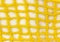 Knitted fabric made of yellow jute, mesh. Close-up.