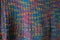 Knitted fabric texture. Closeup view of multicolored fabric jersey. Multicolor abstract background and texture for designers. Colo
