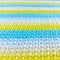 Knitted fabric yellow and blue horizontal stripes.