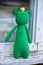 Knitted frog on the window. Handmade toy - green frog for baby. Green Knitted Frog Traveler. Frog princess