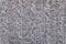 Knitted grey fabric texture with a relief pattern
