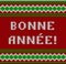 Knitted Lettering. Happy New Year. Text in French. Imitation knitting fabric. Multicolor knitting - letters and ornament.
