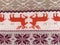 Knitted patterns with snowflakes, deer, flowers, broken stripes. Orange, red brown, white, beige woolen threads. Folk