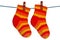 Knitted socks hung on the rope