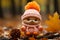 a knitted teddy bear wearing a pink hat and orange scarf