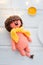knitted toy orange lion with yellow scarf