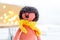 knitted toy orange lion with yellow scarf