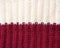 knitted wool background in two colors: Burgundy and white. elastic band binding texture one front one wrong