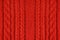 Knitted woolen background, red texture