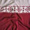 Knitted woolen background. white background with red knitted Norwegian pattern.