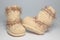 Knitted woolen bootees for young children