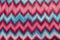 Knitted zigzag missoni pattern of pink and blue threads