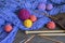 Knitting and hobby concept. Colorful balls of wools, knitting needles and crochet hooks