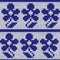 Knitting ornate seamless colourful pattern with dark blue flower