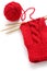 Knitting a red yarn ball with noodles