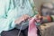 Knitting is a stress-reliever of its own. Closeup shot of an unrecognisable senior woman knitting.