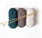 Knitting. Woolen yarn of green, coffee and milk color with wooden knitting needles for knitting