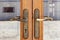Knockers and handles on ancient doors, Old metal door handle on a wooden door
